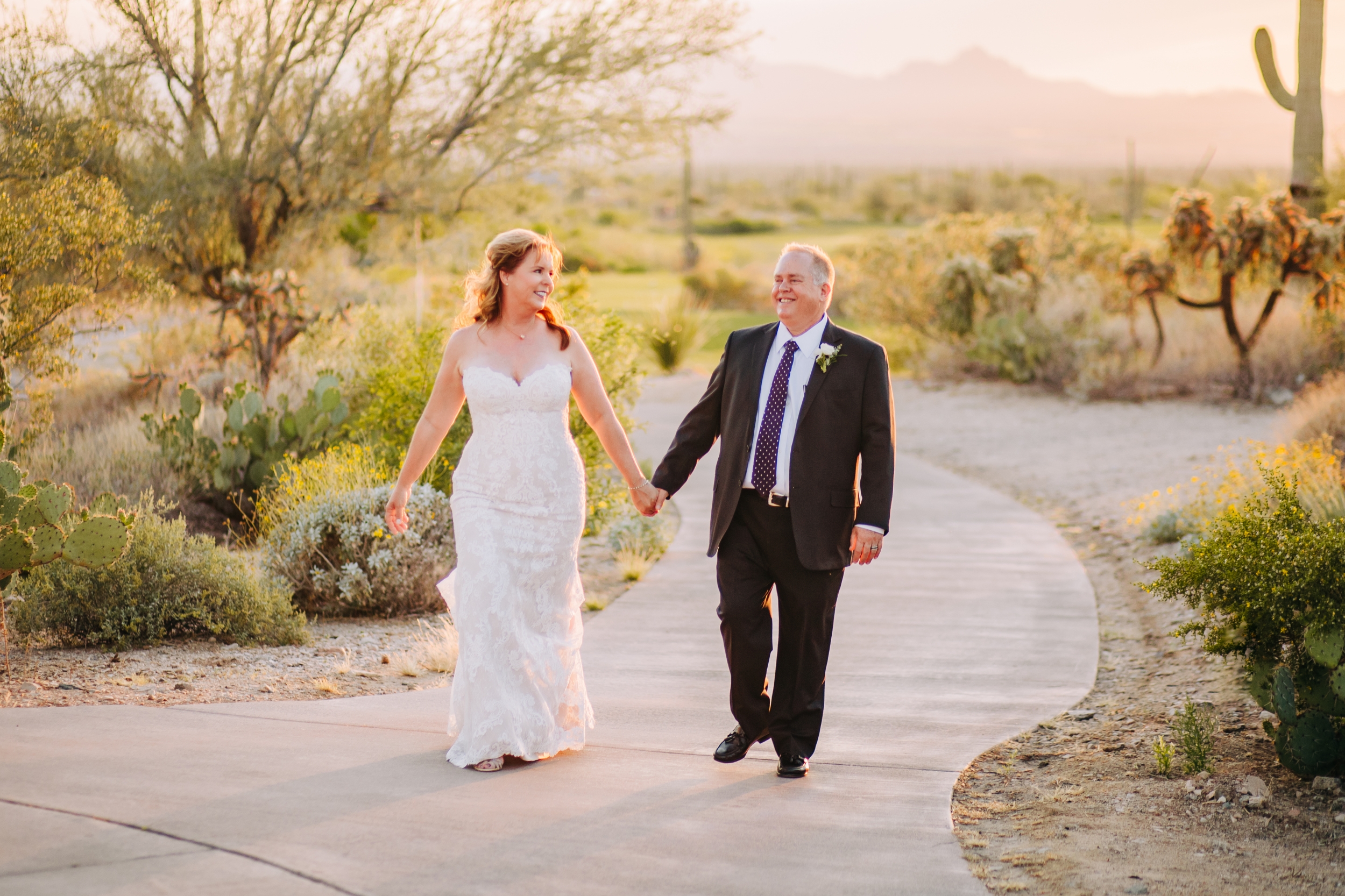 Tucson-Wedding-Photographer---Marana-Wedding-Photographer---Ritz-Carlton-Dove-Mountain-Wedding---Bride-And-Groom-Photos---Wedding-Photographer-Near-Me---Romantic-Wedding-Photos---Bride-And-Groom-Walking