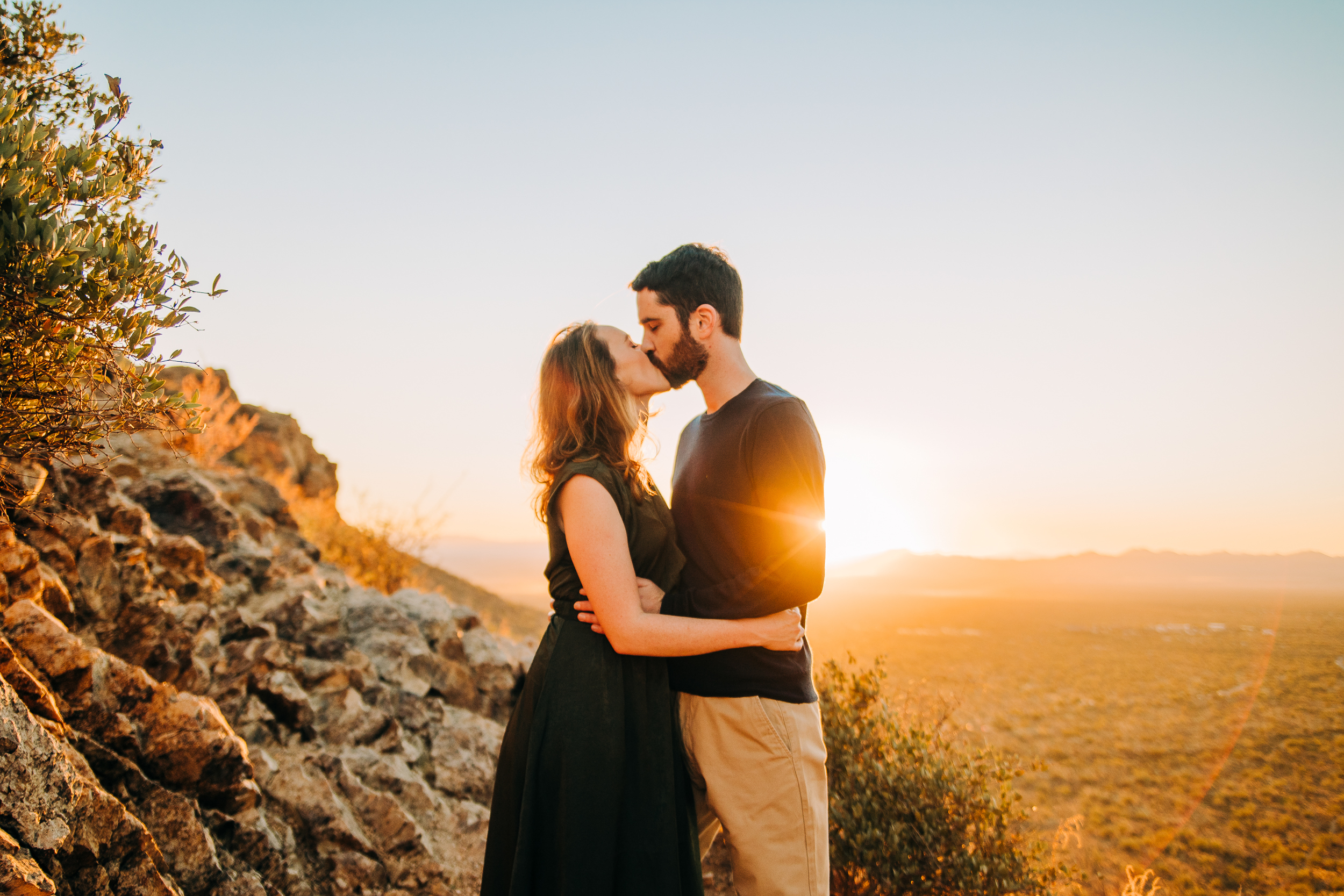 tucson-engagement-photographer-golden-hour-gates-pass-couple-photos-desert-candid-romantic-timeless-photographer-near-me-sunset-saguaro-national-park-embrace-kiss